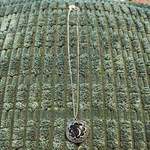 Elegant Silver and Black Necklace with Timeless Charm